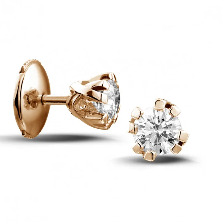 0.60 quilates pendientes diamantes diseño en oro rojo con ocho garras 